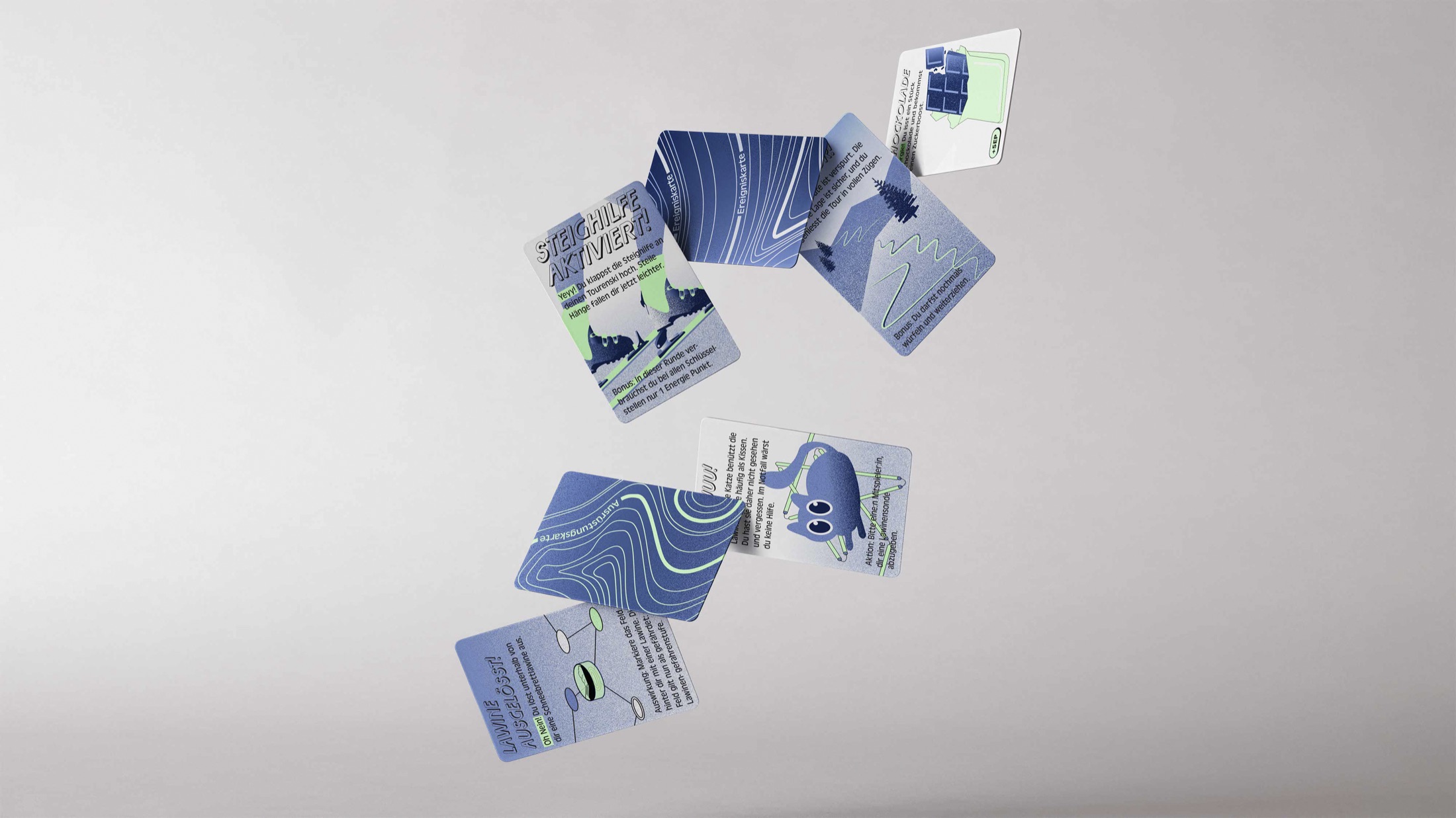 Touriski avalanche-safety board game cards floating in the air